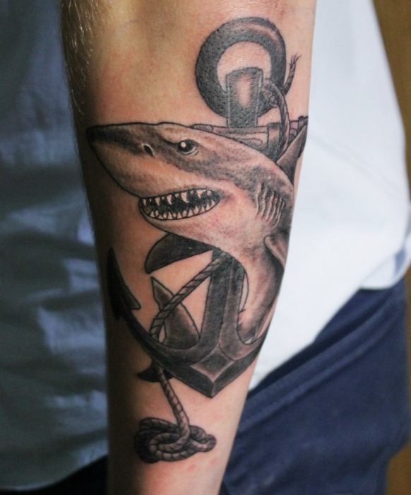 Black Ink Shark With Anchor Tattoo On Left Arm