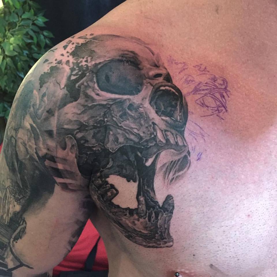 Black Ink Skull Tattoo On Shoulder By Elvin