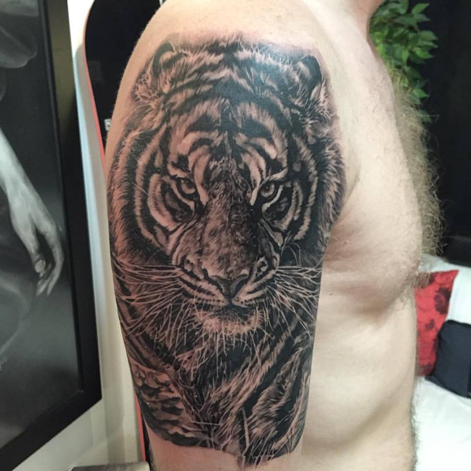 Black Ink Tiger Tattoo On Man Right Half Sleeve By Elvin
