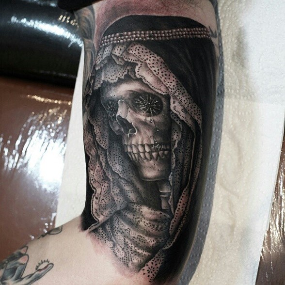 Black Ink Women Skull Tattoo On Bicep By Mick Squires