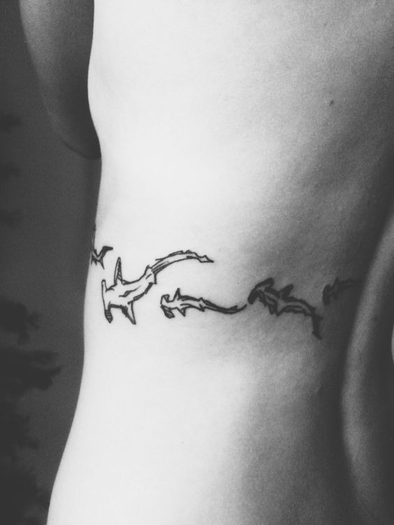 Black Outline Hammerhead Sharks Tattoo On Left Side Rib By Glen Sluder