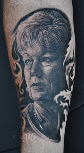 Black and grey Old Women Portrait Tattoo Design For Forearm By Mike Devries