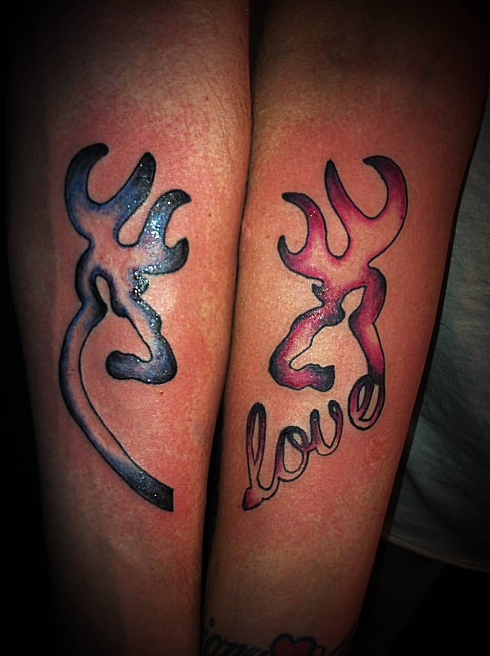 Blue And Red Ink Deer Tattoos On Both Forearm