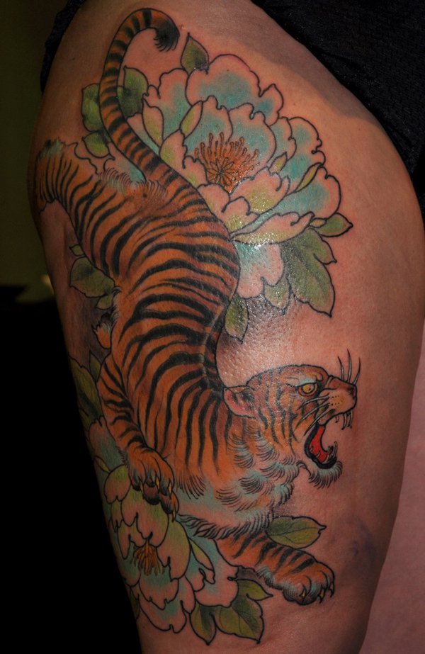 Blue Flowers And Chinese Tiger Tattoo On Thigh
