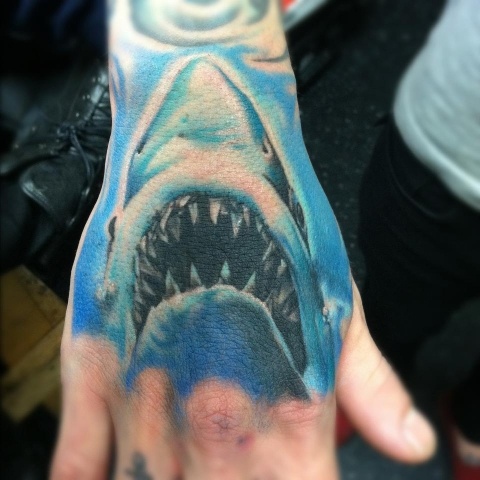 Blue Ink Shark Head Tattoo On Right Hand