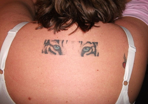 Blue Tiger Eyes Tattoo On Girl Upper Back