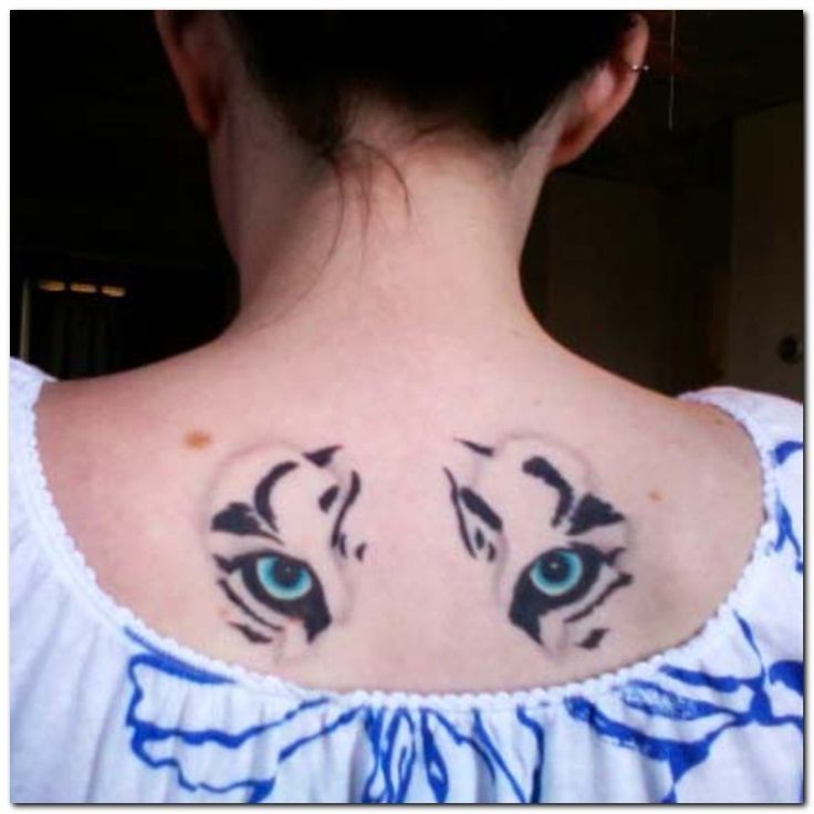 Blue Tiger Eyes Tattoo On Upper Back