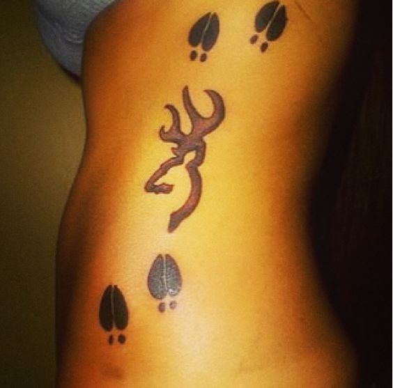 Browning Deer Tattoo And Deer Track Tattoo On Girl Side Rib
