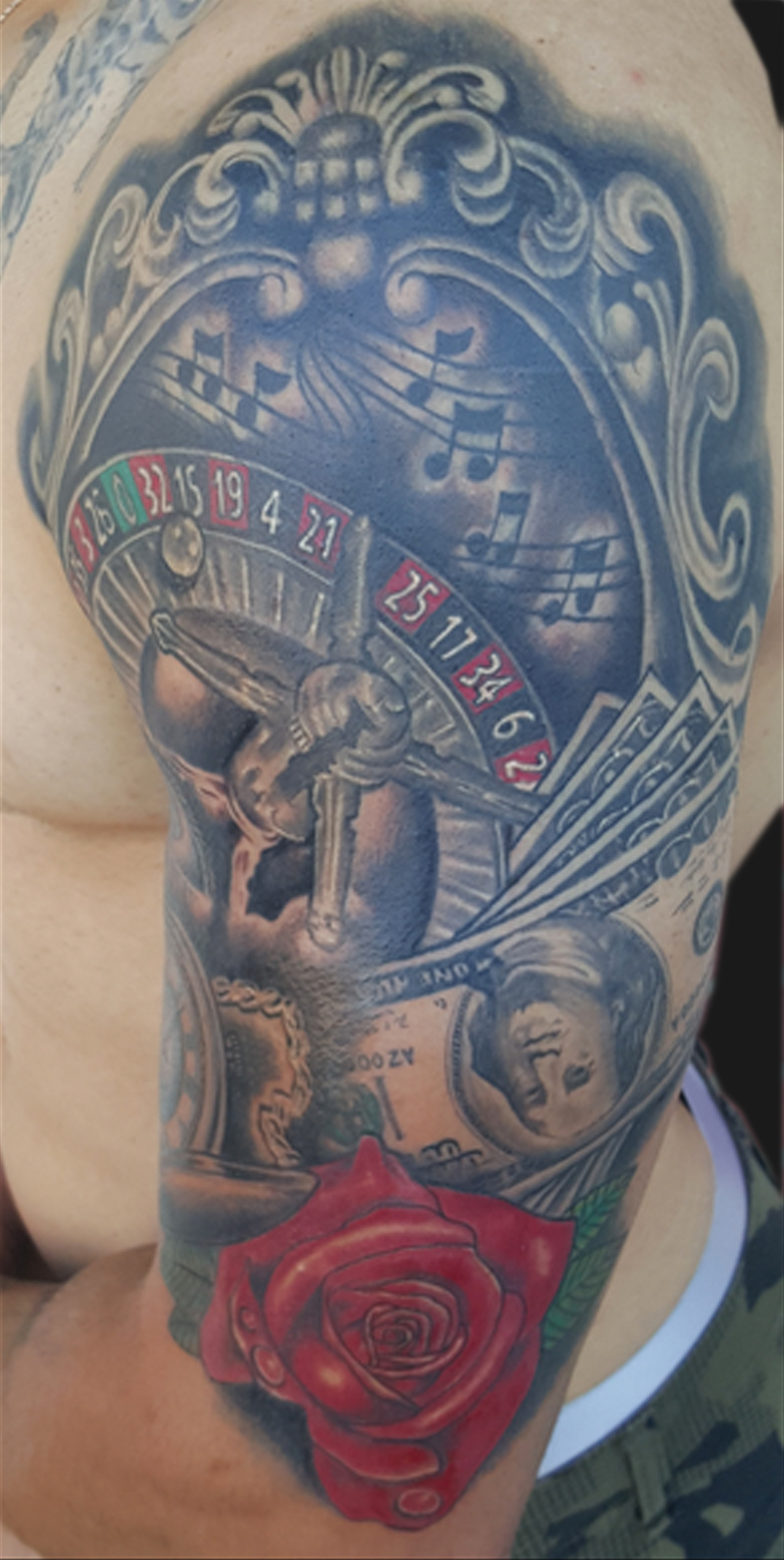 Casino Roulette Wheel With Rose Tattoo On Man Left Half Sleeve
