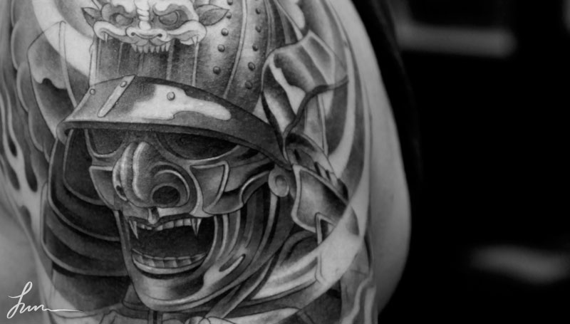 Cool Black And Grey Samurai Head Tattoo On Shoulder