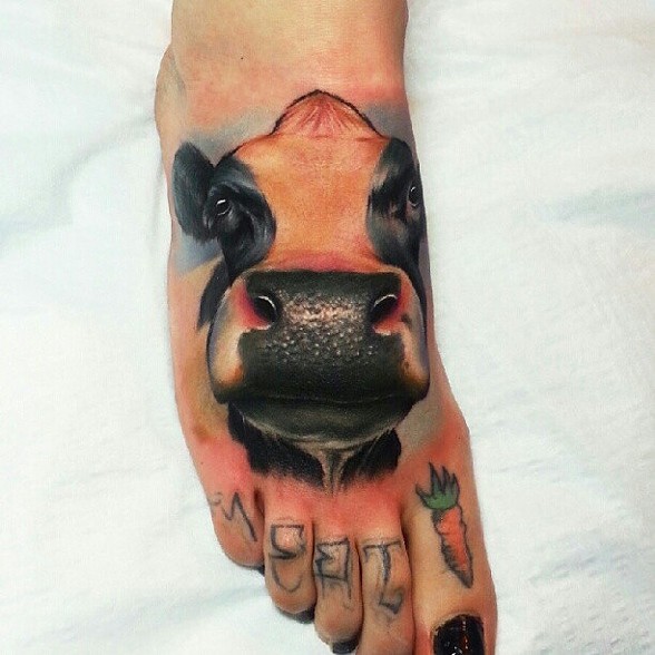 Cool Cow Head Tattoo On Girl Right Foot