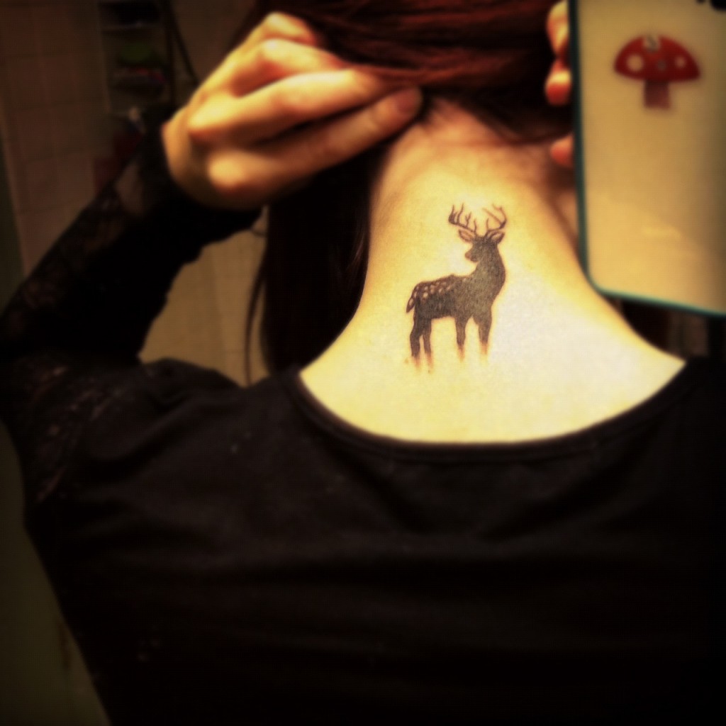 Cute Black Silhouette Deer Tattoo On Nape