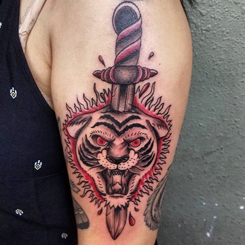 Dagger In Tiger Head Tattoo On Bicep