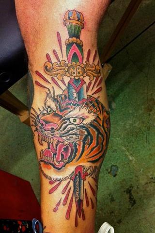Dagger In Tiger Head Tattoo On Leg