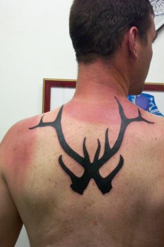 Deer Antler Tattoos On Man Upper Back