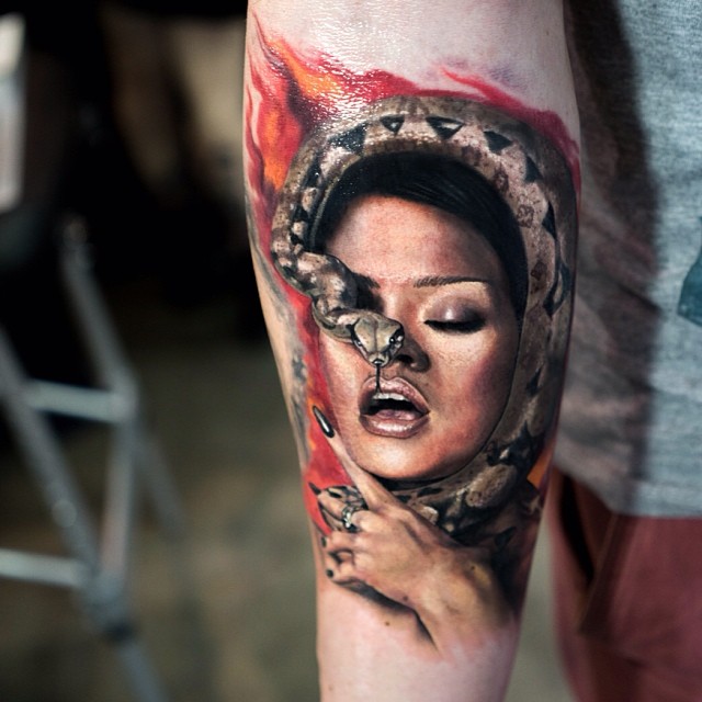 Fantastic Girl Face With Snake Tattoo On Right Forearm By Mick Squires