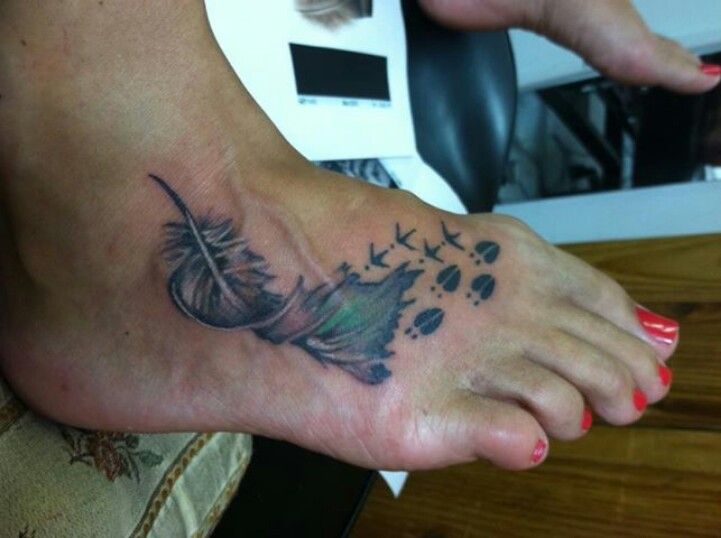 Feather And Deer Track Tattoo On Foot