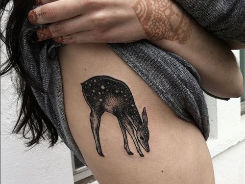 Girl Showing Her Cute Deer Tattoo On Side Rib