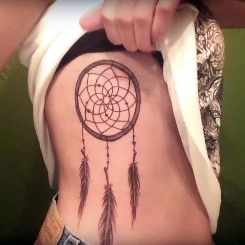 Girl Showing Her Simple Dreamcatcher Tattoo