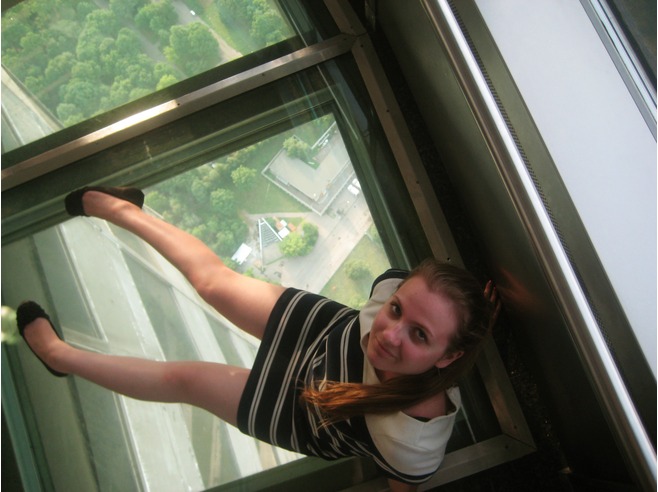 Girl Sitting On Glass Floor Inside The Ostankino Tower