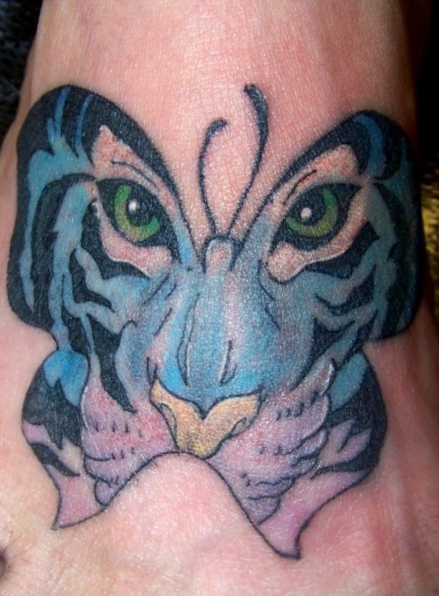 Green Tiger Eyes In Blue Butterfly Tattoo
