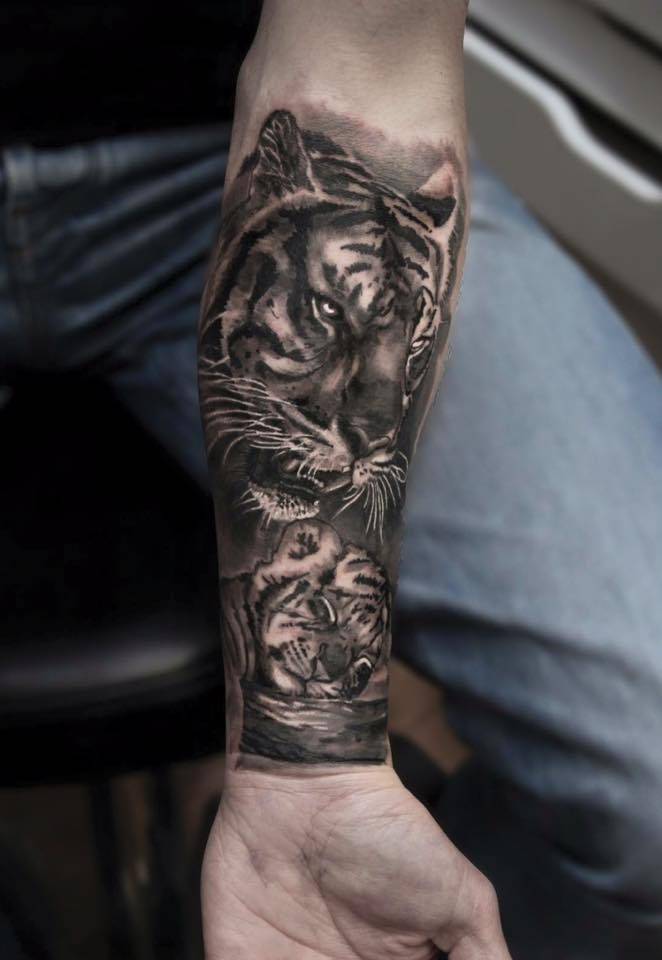 Grey And Black Tiger Tattoo On Forearm