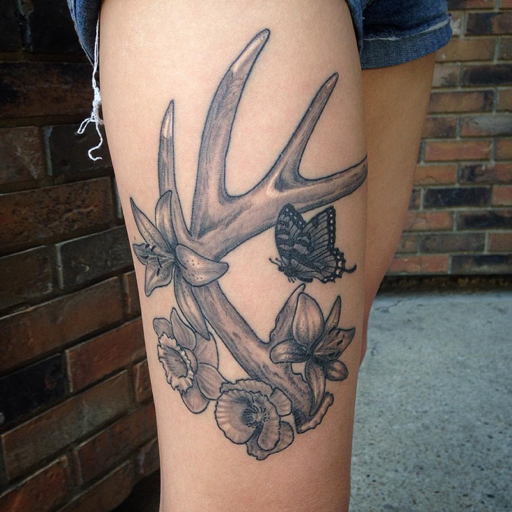 Grey Ink Butterfly And Deer Antler Tattoo On Side Thigh