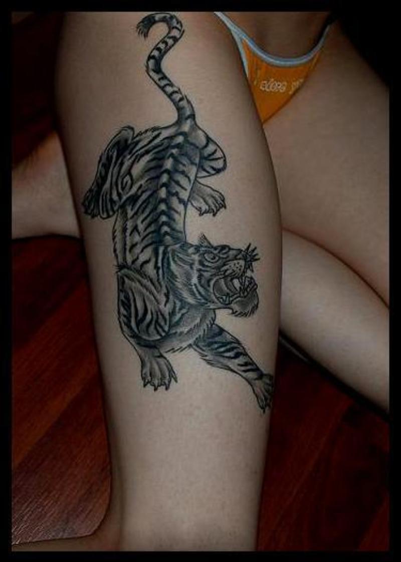 Grey Ink Tiger Tattoo On Girl Thigh