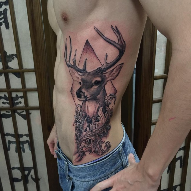 Grey Ink Tribal Deer Tattoo On Side Rib