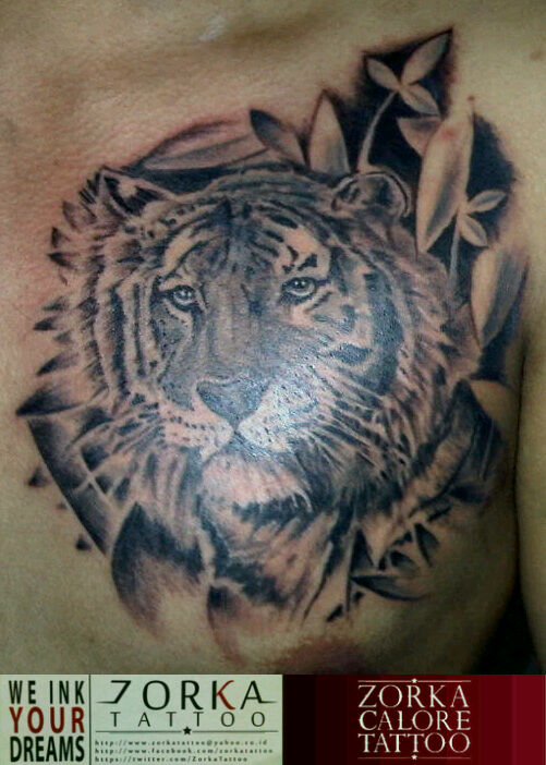 Grey Leaves And Tiger Head Tattoo On Chest