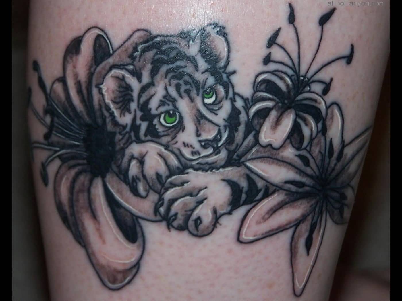 Grey Lily Flowers And Green Eyes Baby Tiger Tattoo