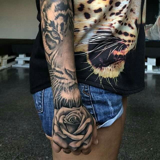 Grey Rose Flower And Tiger Face Tattoo On Forearm
