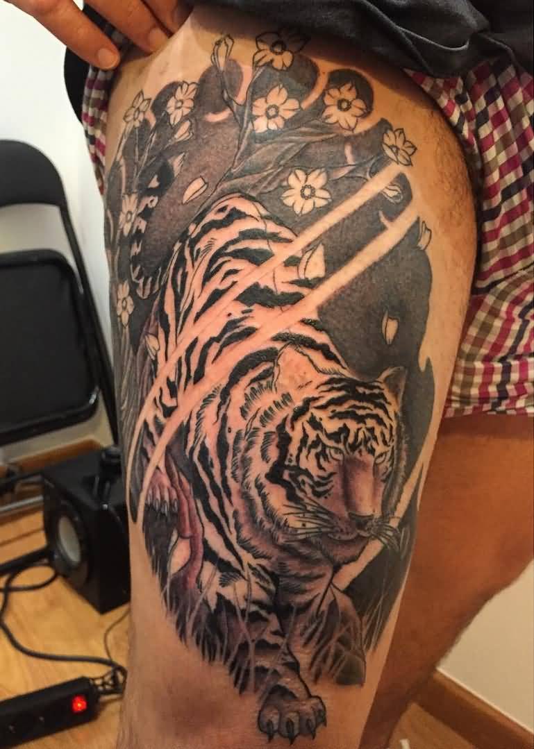 Guy Showing Japanese Tiger Tattoo On Thigh