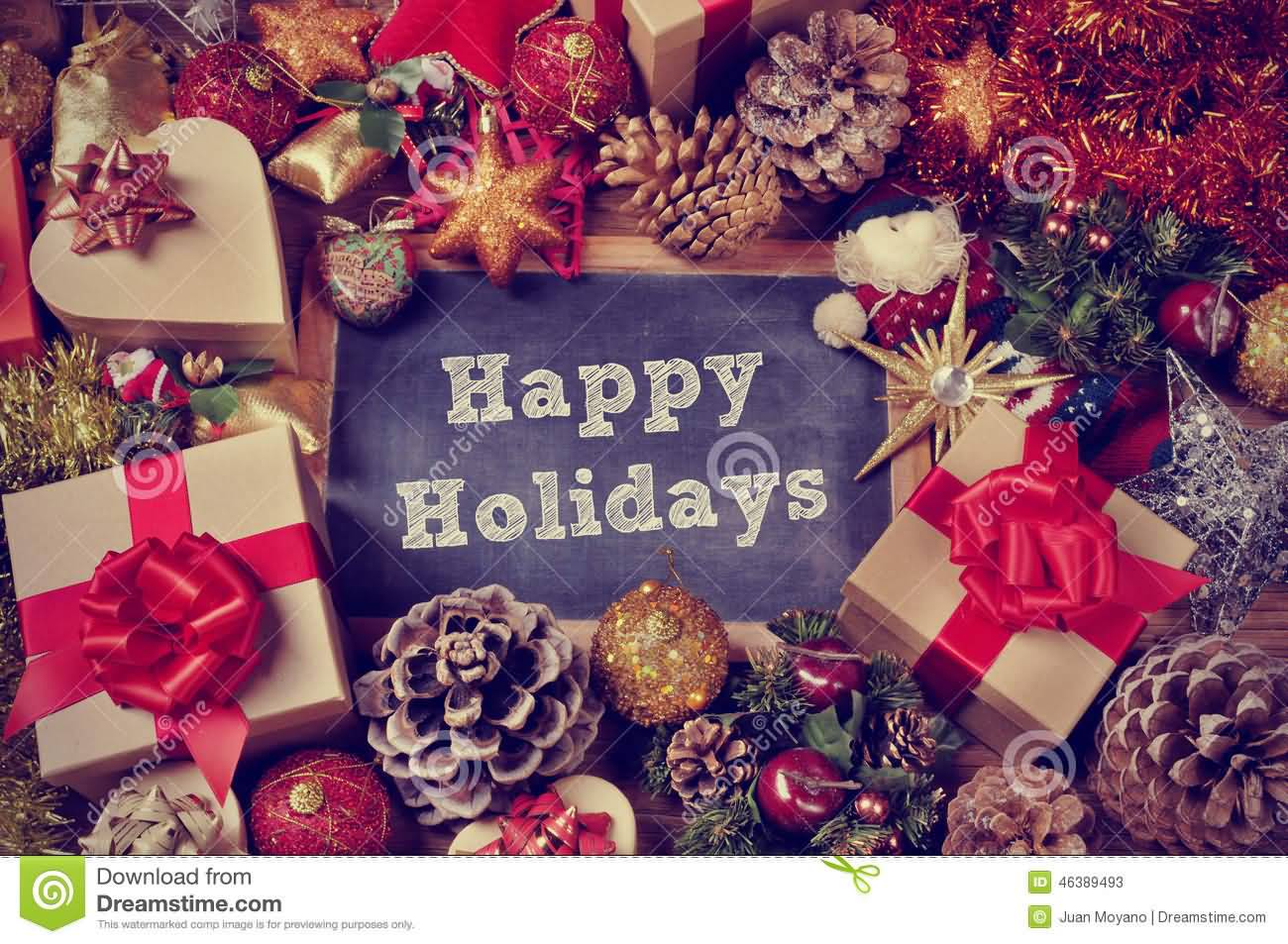 Happy Holiday Text On Blackboard With Gifts