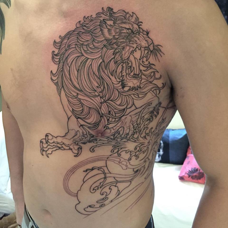 Impressive Black Lion Tattoo On Man Left Chest