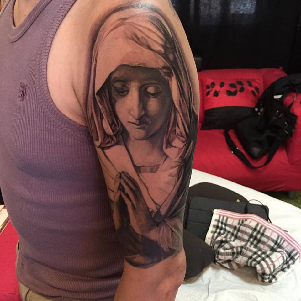 Impressive Virgin Mary Tattoo On Man Left Half Sleeve