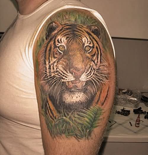 Left Shoulder Green Leaves And Tiger Head Tattoo