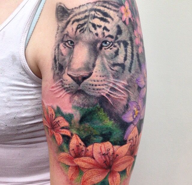 Lily Flowers And Tiger Head Tattoo On Left Shoulder