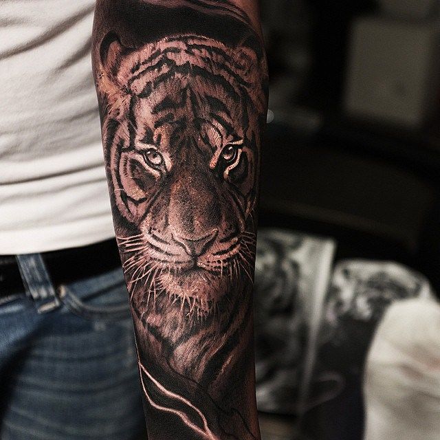 Man With Grey Ink Tiger Tattoo on Forearm
