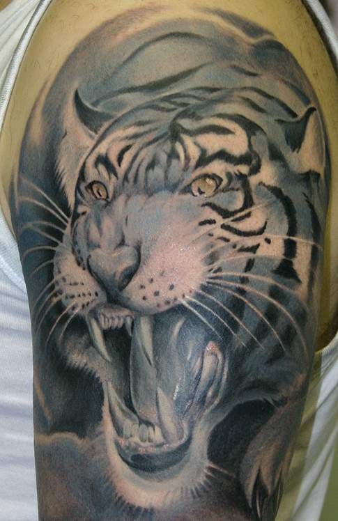 Nice Blue Ink Tiger Head Tattoo On Half Sleeve