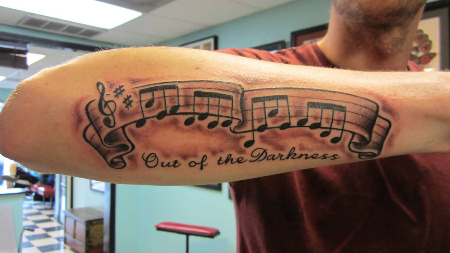 Out Of The Darkness - Black Ink Music Knots Tattoo On Man Right Arm By Roger McMahon