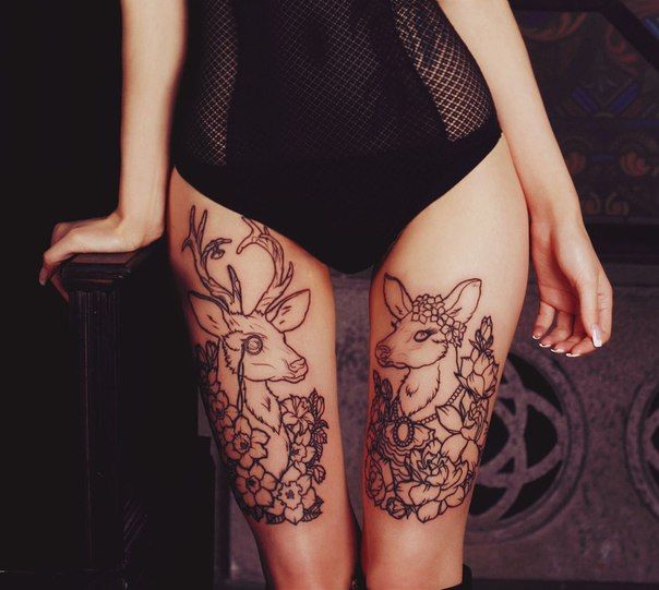 Outline Flowers And Deer Tattoos On Girl Both Thigh
