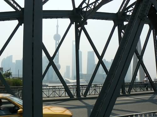 Pudong Skyline Through The Waibaidu Bridge