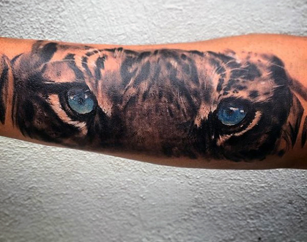 Realistic Blue Tiger Eyes Tattoo On Arm