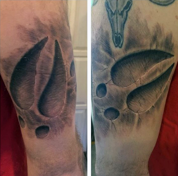Realistic Grey Ink Deer Track Tattoo On Bicep