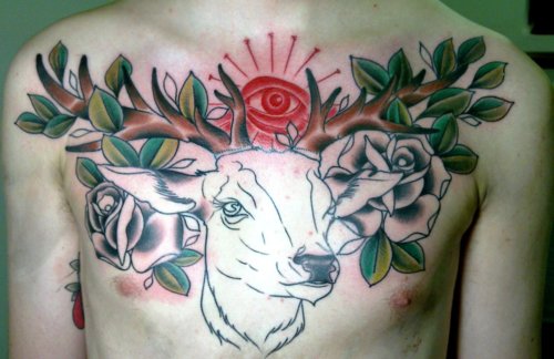 Red Eye And Traditional Deer Tattoo On Man Chest
