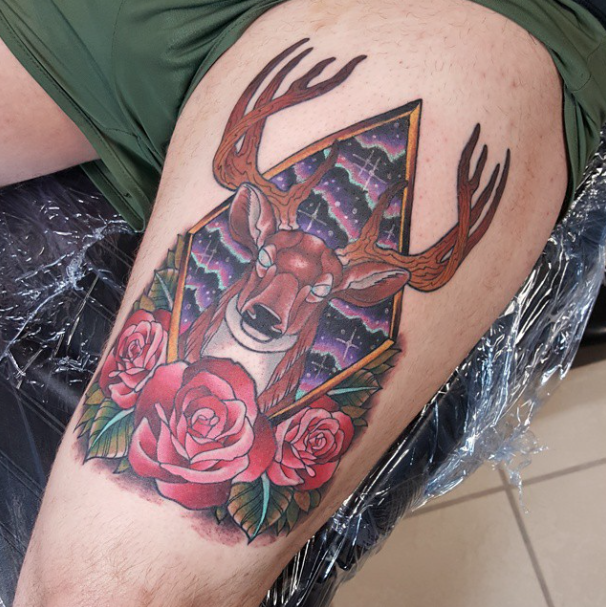 Red Roses And Deer Antler Tattoo On Left Thigh