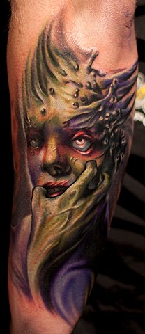 Scary Alien Tattoo On Man Left Arm By Mick Squires