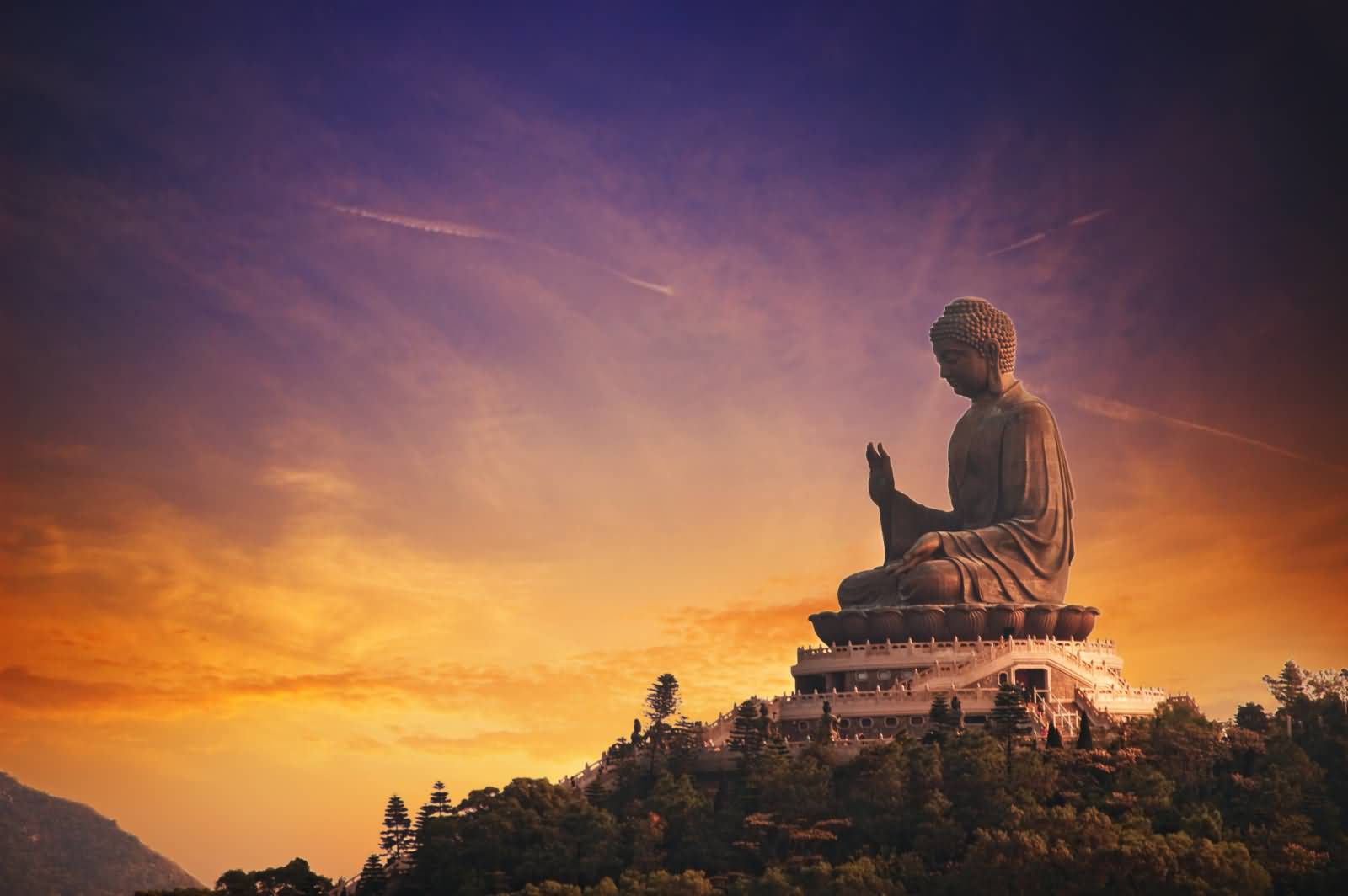 Side View Of Tian Tan Buddha Statue During Sunset