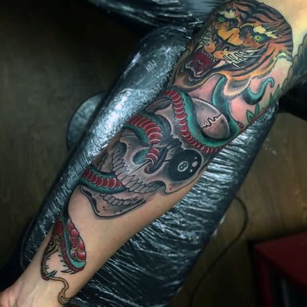 Skull With Snake And Tiger Tattoo On Left Forearm